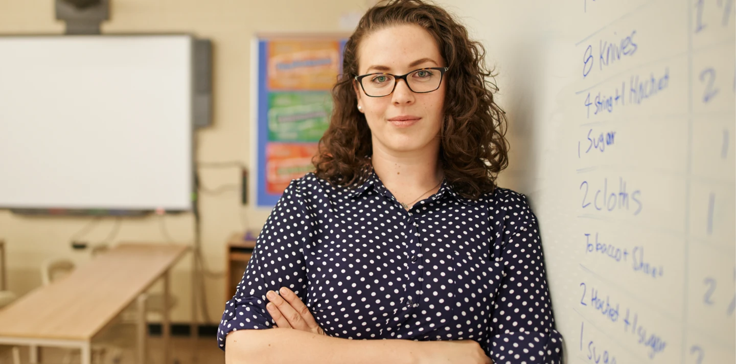 Woman wearing glasses standing in an office